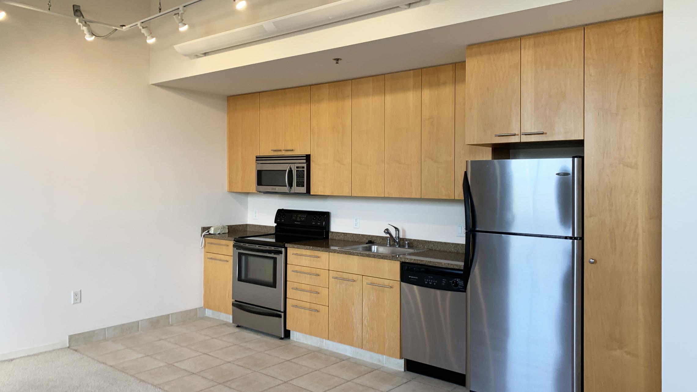 Tobacco-Lofts-at-The-Yards-Apartment-E310-One-Bedroom-Historic-Exposed-Brick-Timber-Beams-Unique-Design-Cats-High-Ceiling-Balcony-Downtown-Madison-Fitness-Lounge-Courtyard-Top-Floor-Vaulted-Ceiling