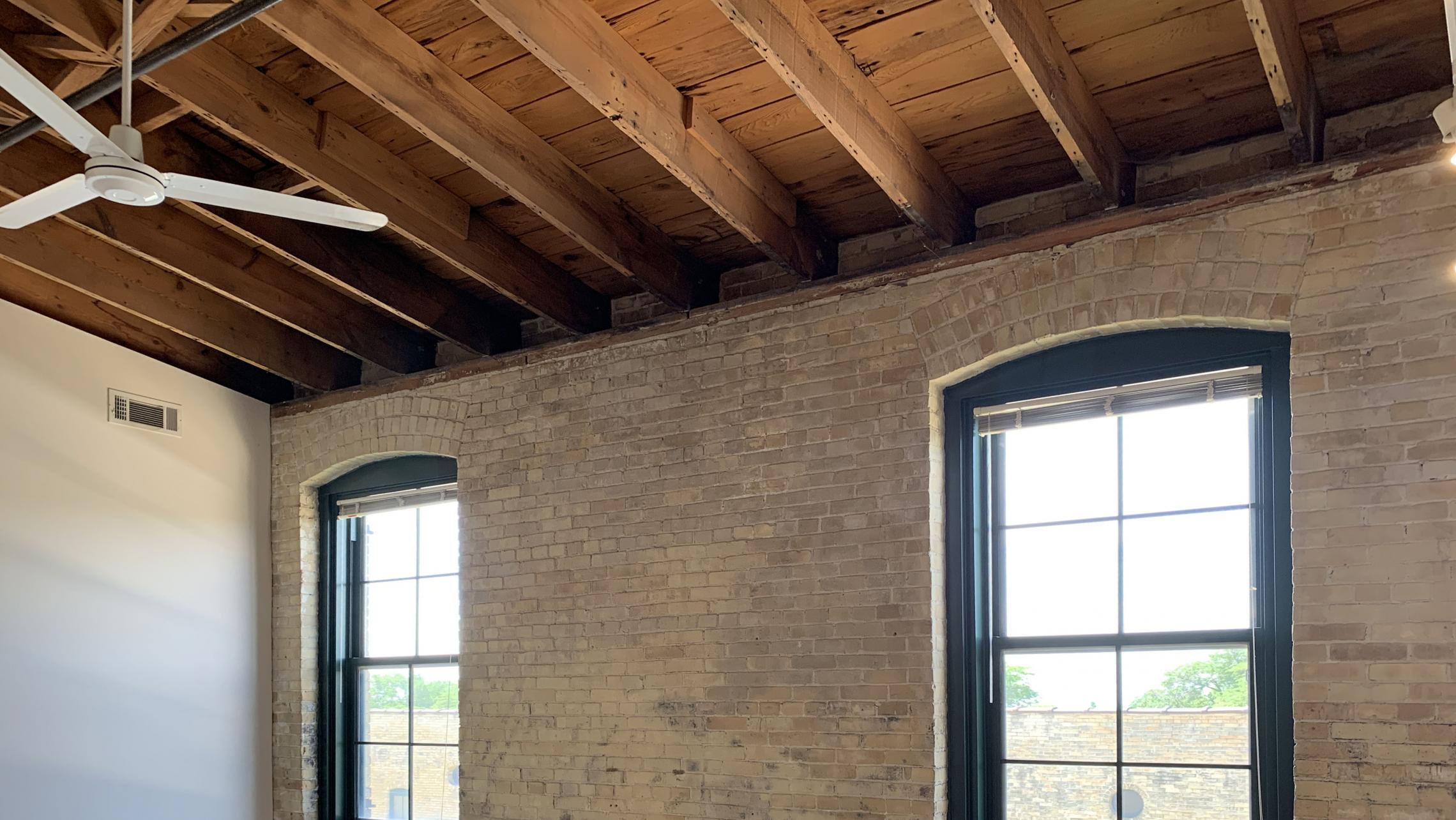 Tobacco-Lofts-at-The-Yards-Apartment-E310-One-Bedroom-Historic-Exposed-Brick-Timber-Beams-Unique-Design-Cats-High-Ceiling-Balcony-Downtown-Madison-Fitness-Lounge-Courtyard-Top-Floor-Vaulted-Ceiling