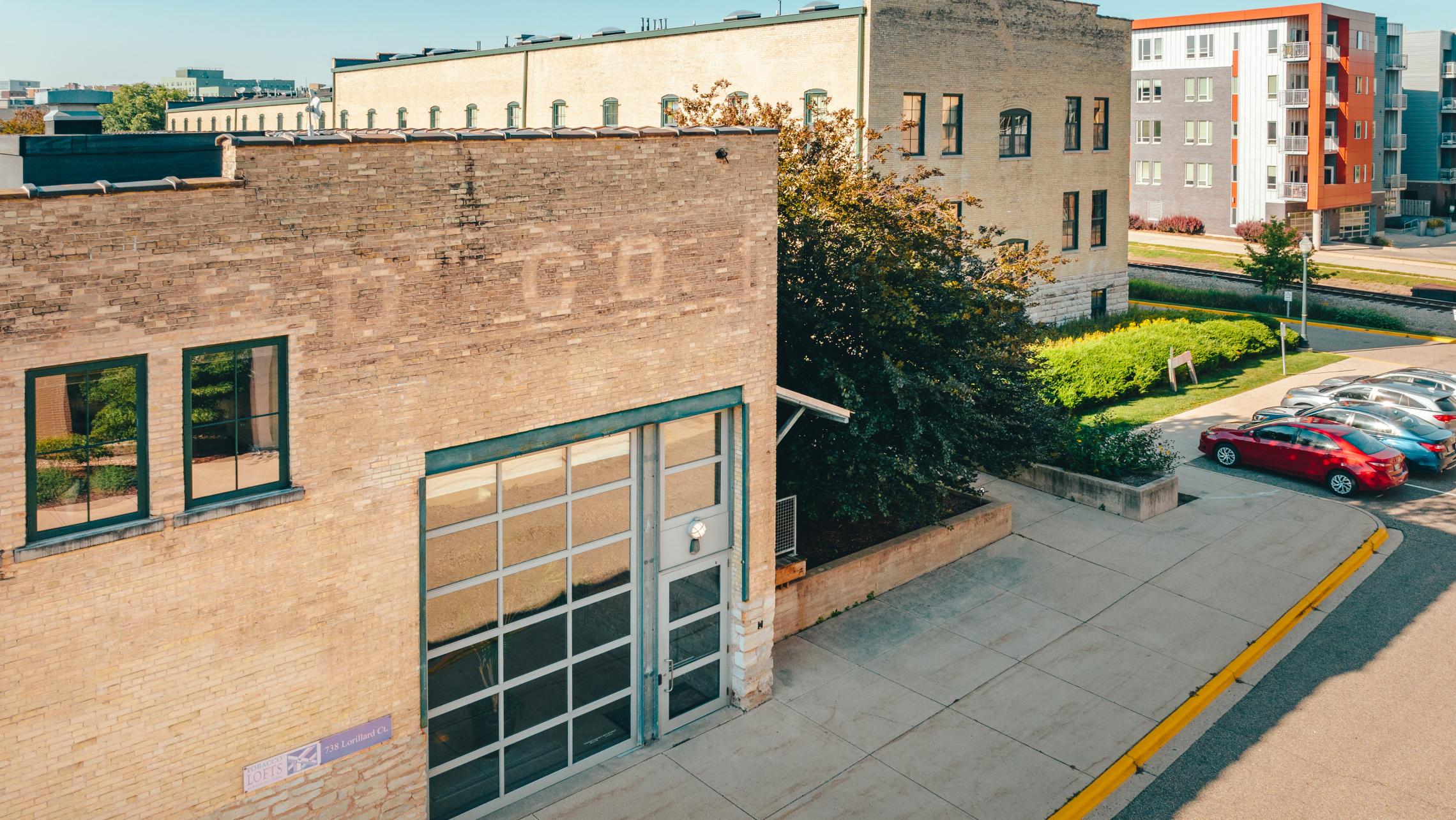 Tobacco-Lofts-Historic-Lofted-Apartments-Downtown-Madison-Exposures-Design-Brick-Beams-Vaulted-Ceiling-Skylight-Yards-Lifestyle.jpg