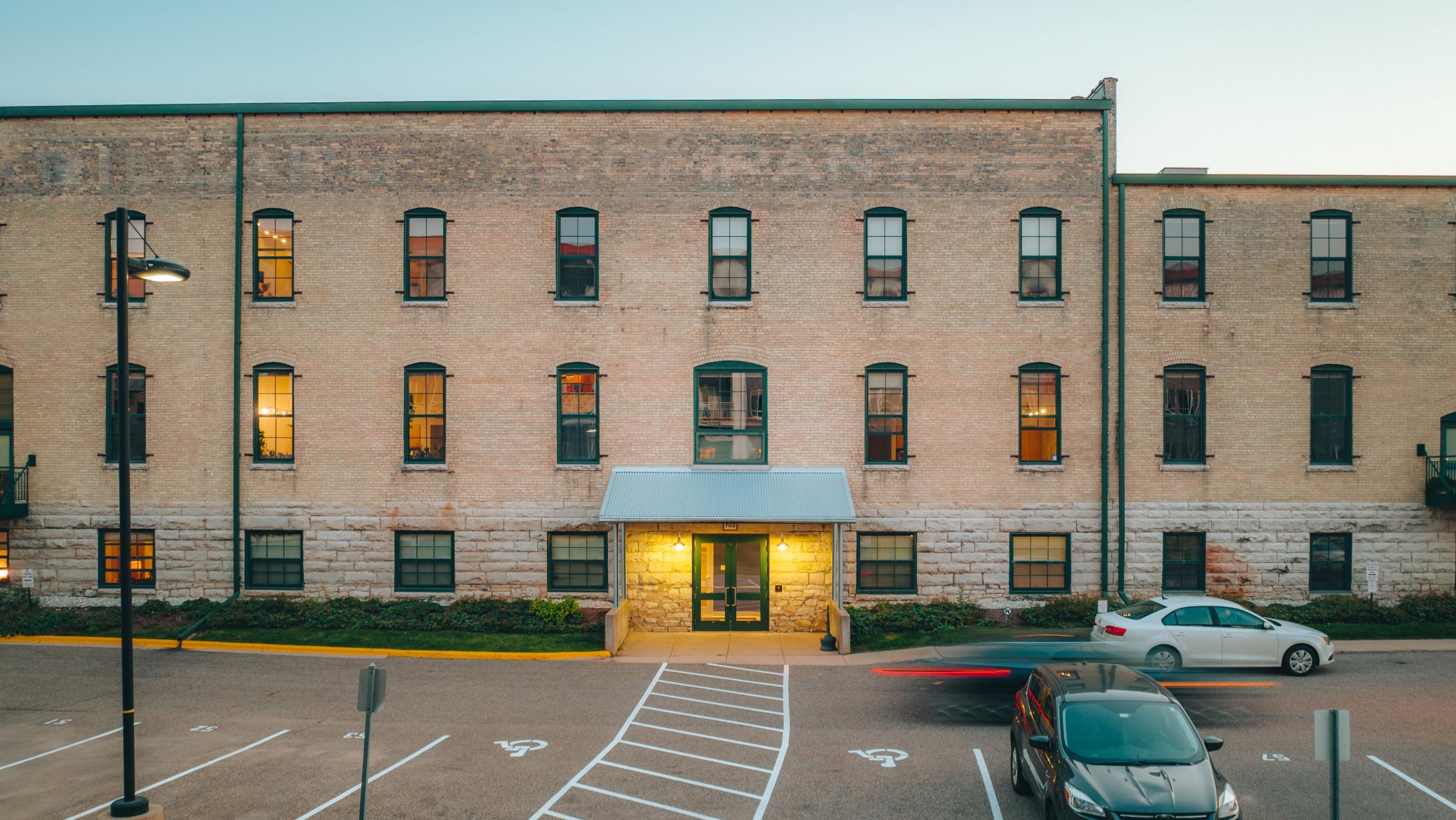 Tobacco-Lofts-Historic-Lofted-Apartments-Downtown-Madison-Exposures-Design-Brick-Beams-Vaulted-Ceiling-Skylight-Yards-Lifestyle.jpg