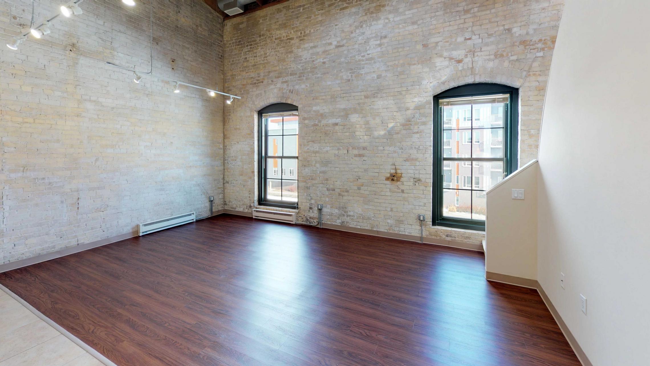 E307-Historic-Downtown-Lofted-Two-Bedroom-Madison-Exposed-Brick-Design-Beams-Dining-Tobacco-Lofts