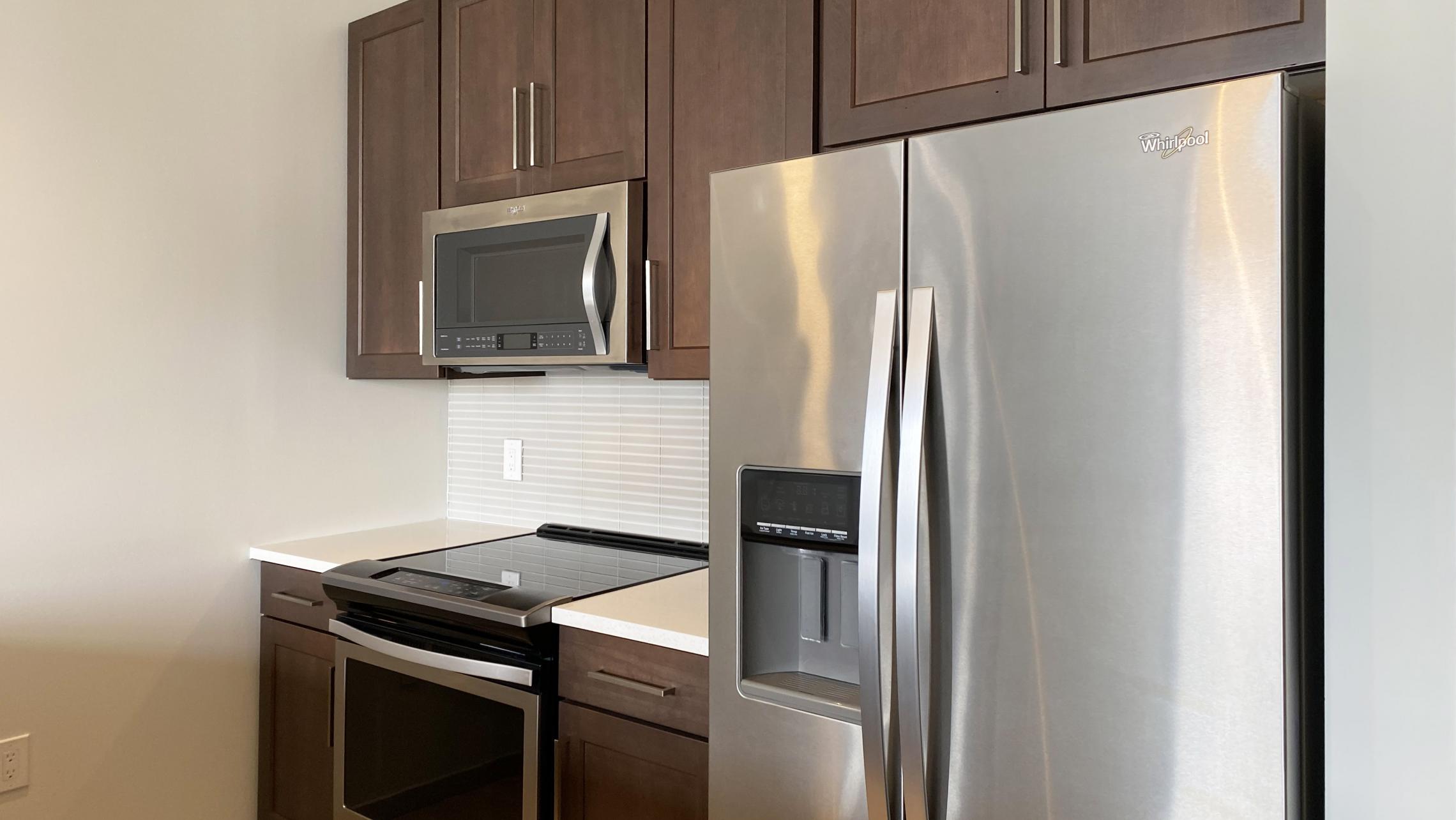 The-Pressman-Apartment-411-One-Bedroom-One-Bath-Kitchen-Living-Upscale-Luxurious-Modern-Exposed-Duct-Concrete-Capitol-Square-Downtown-Madison-Balcony-Terrace-Pets-Fitness-Lounge-Grill-Lifestyle