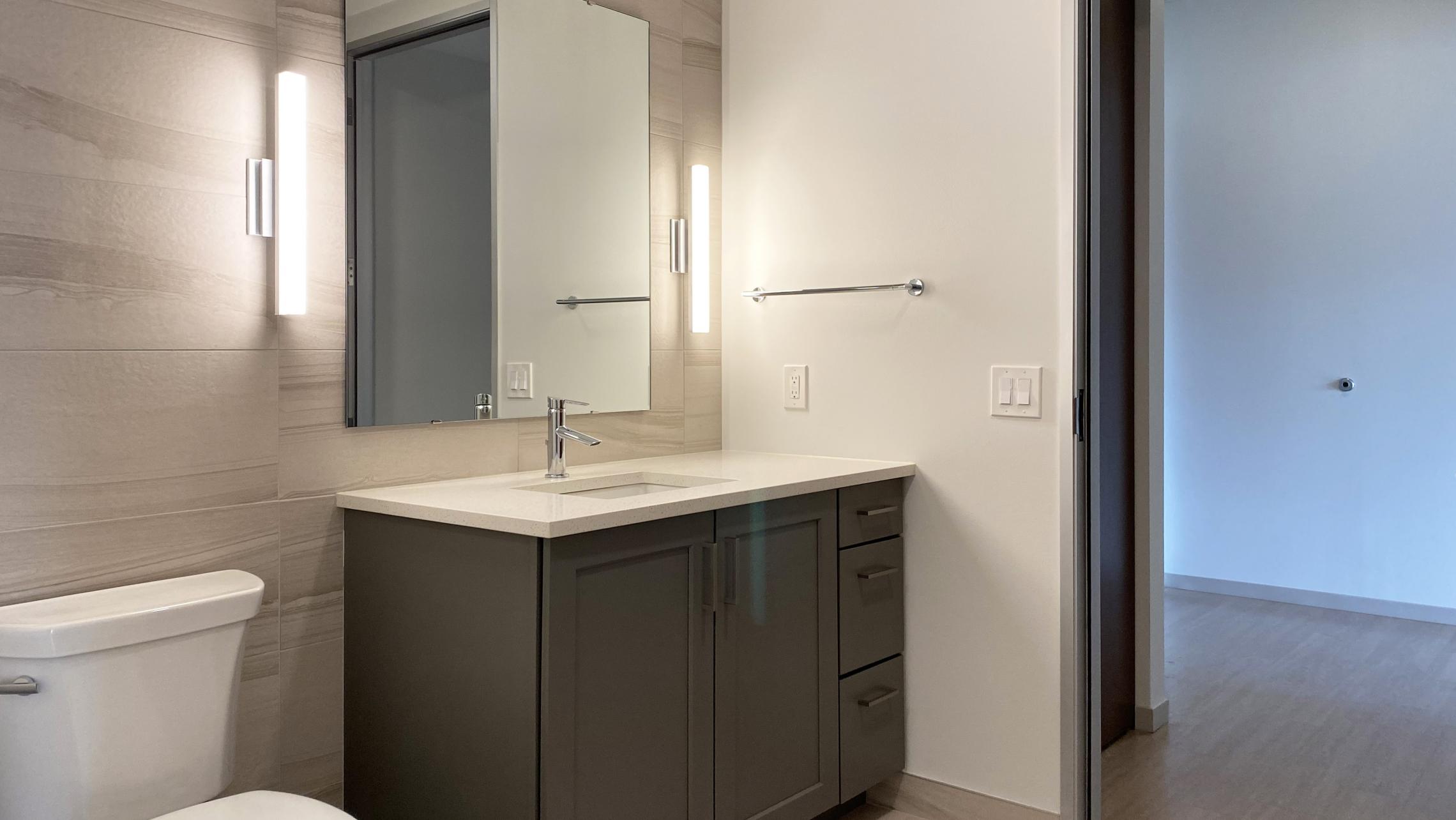 The-Pressman-Apartment-411-One-Bedroom-One-Bath-Kitchen-Living-Upscale-Luxurious-Modern-Exposed-Duct-Concrete-Capitol-Square-Downtown-Madison-Balcony-Terrace-Pets-Fitness-Lounge-Grill-Lifestyle