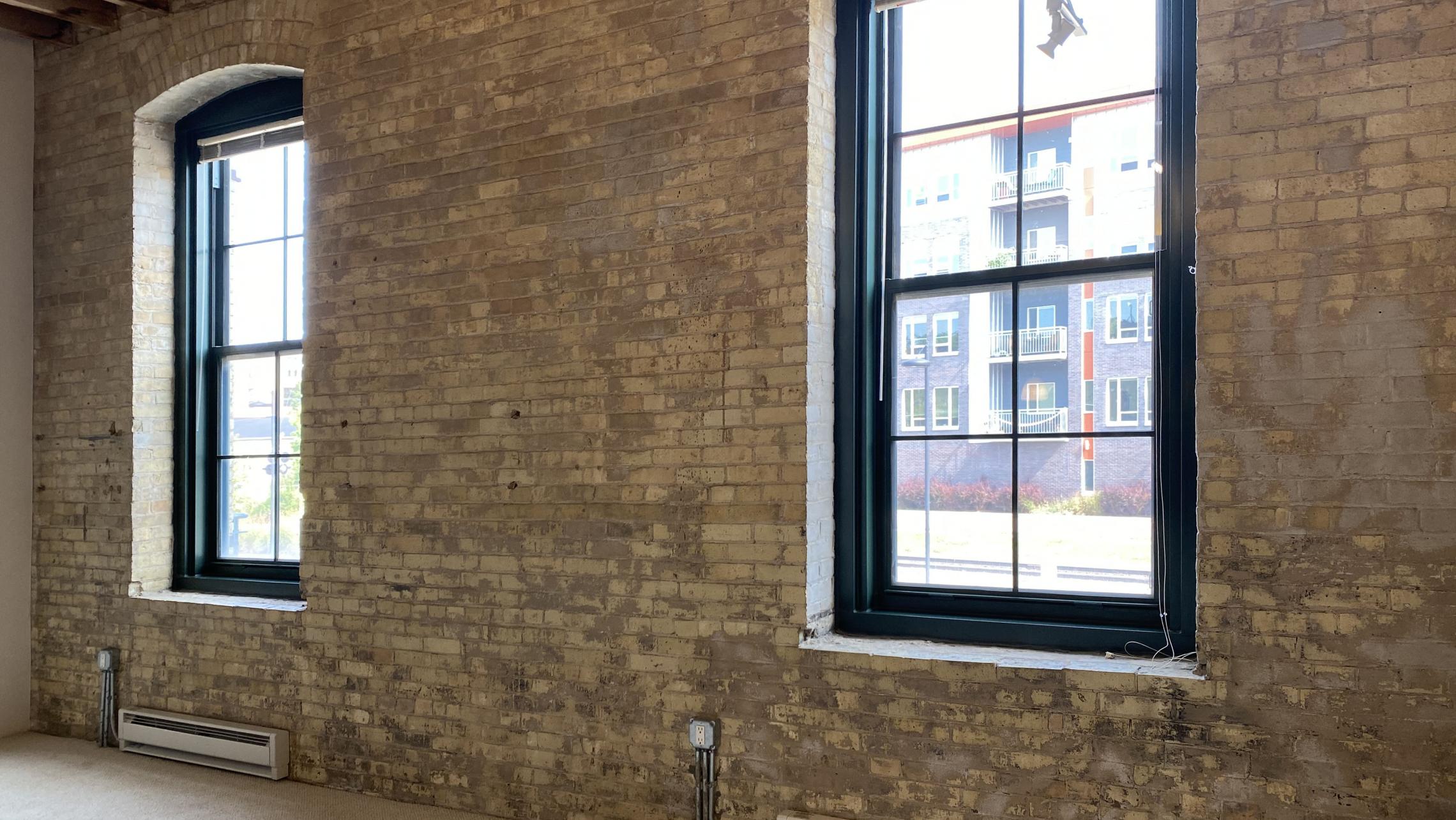 Tobacco-Lofts-at-The-Yards-Apartment-E209-One-Bedroom-Historic-Exposed-Brick-Timber-Beams-Unique-Design-Cats-High-Ceiling-Balcony-Downtown-Madison-Fitness-Lounge-Courtyard