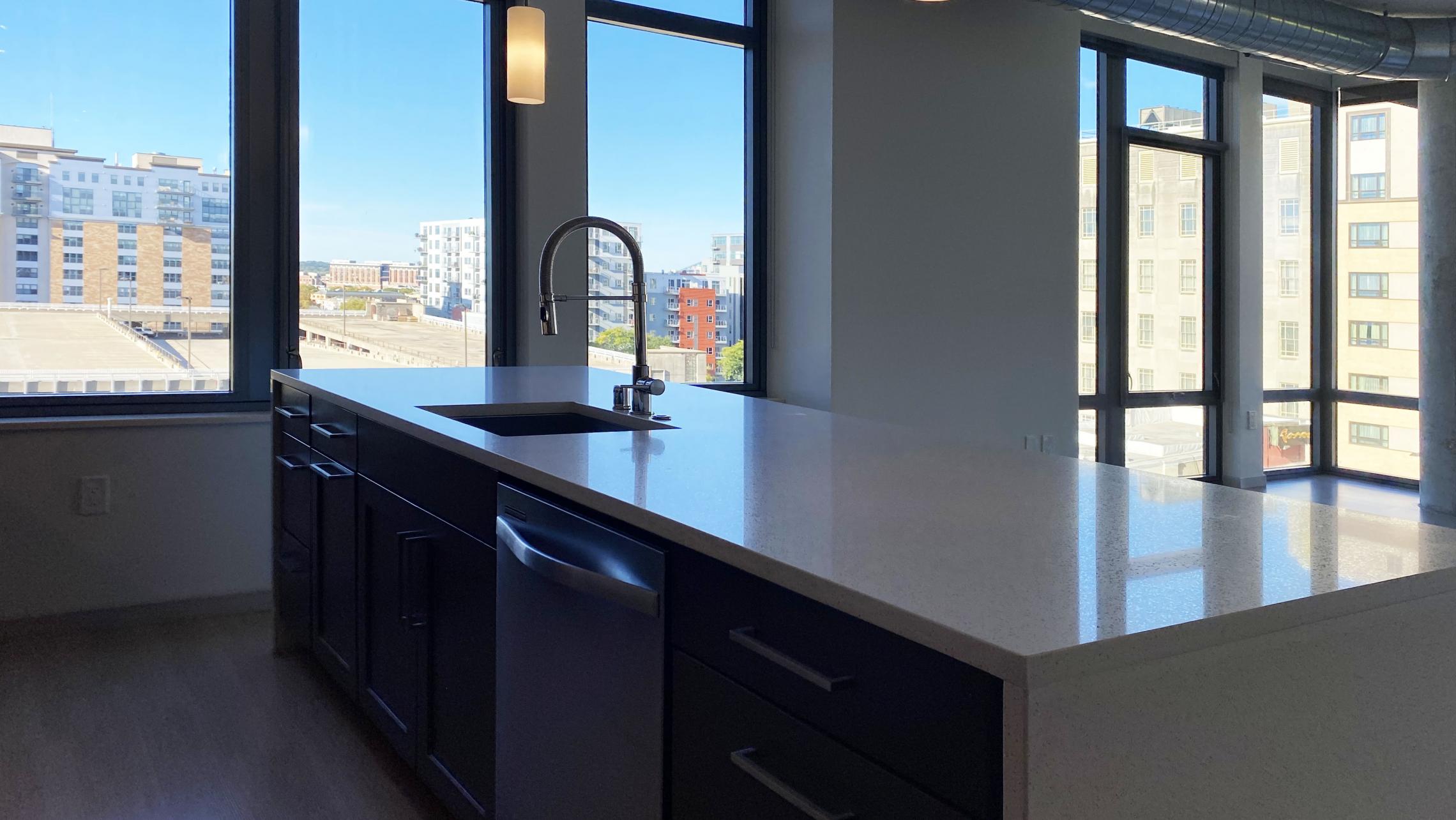 The-Pressman-Apartment-602-Two-Bedroom-Two-Bath-Kitchen-Living-Upscale-Luxurious-Modern-Exposed-Duct-Concrete-Capitol-Square-Downtown-Views-Madison-Balcony-Terrace-Pets-Fitness-Lounge-Grill-Lifestyle