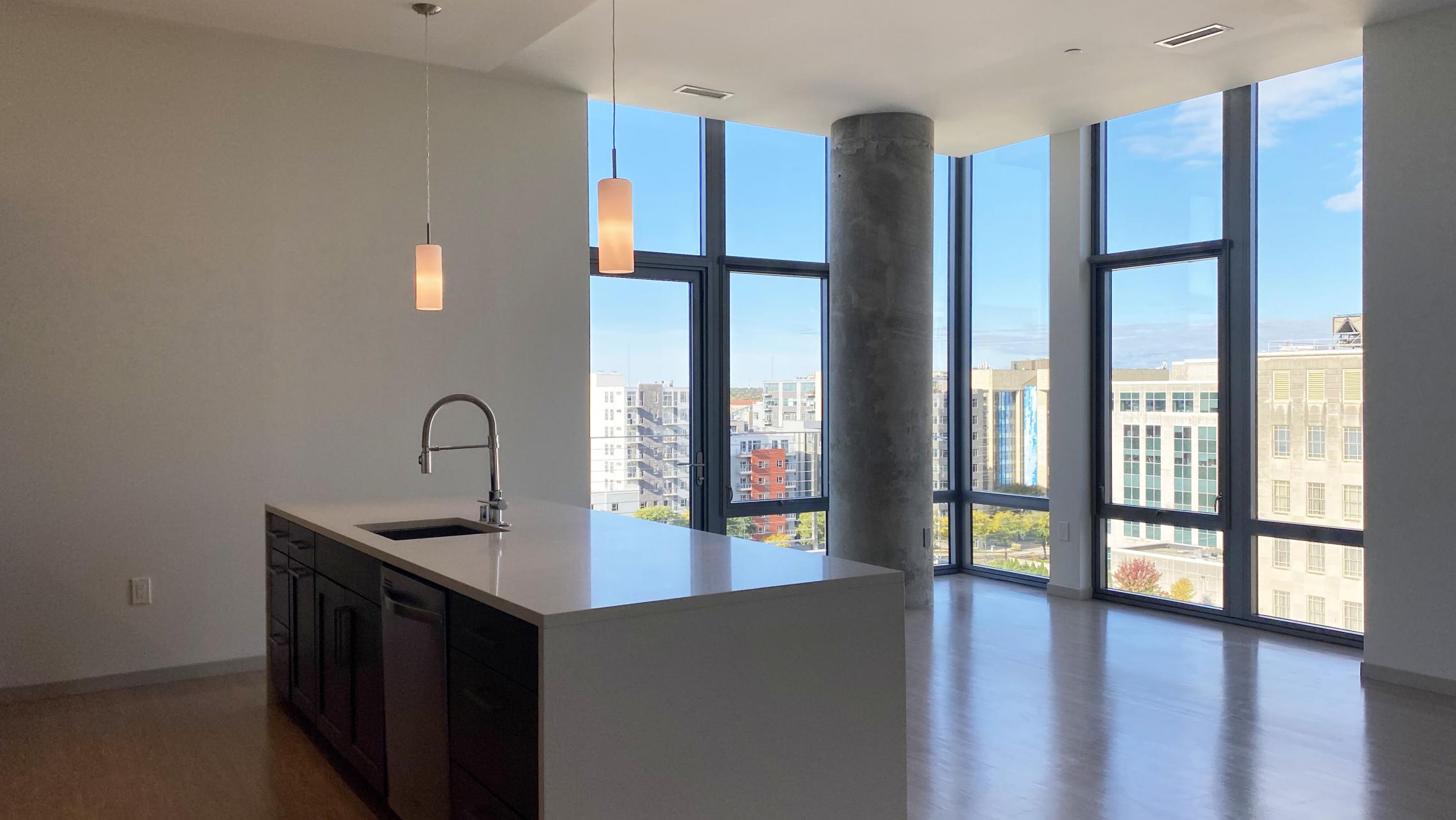 The-Pressman-Apartments-Two-Bedroom-912-Modern-Upscale-Luxury-Top-Floor-Capitol-Lake-View-Balcony-Corner-Lifestyle-Downtown-Madison-Design-Concrete-Kithcen-Living-Dining-Windows-Dogs-Cats-Pets-Fitness-Lounge