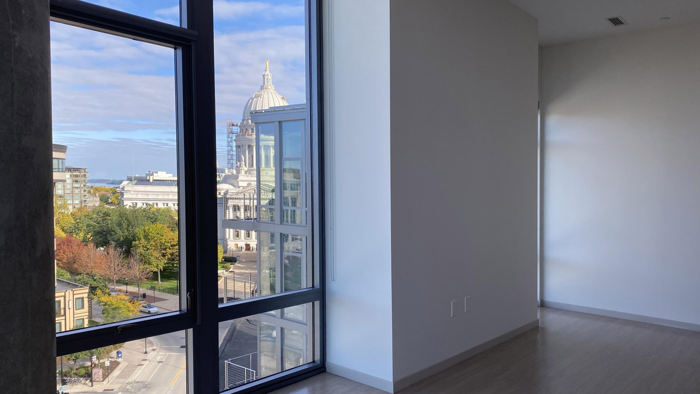 The-Pressman-Apartments-Two-Bedroom-912-Modern-Upscale-Luxury-Top-Floor-Capitol-Lake-View-Balcony-Corner-Lifestyle-Downtown-Madison-Design-Concrete-Kithcen-Living-Dining-Windows-Dogs-Cats-Pets-Fitness-Lounge