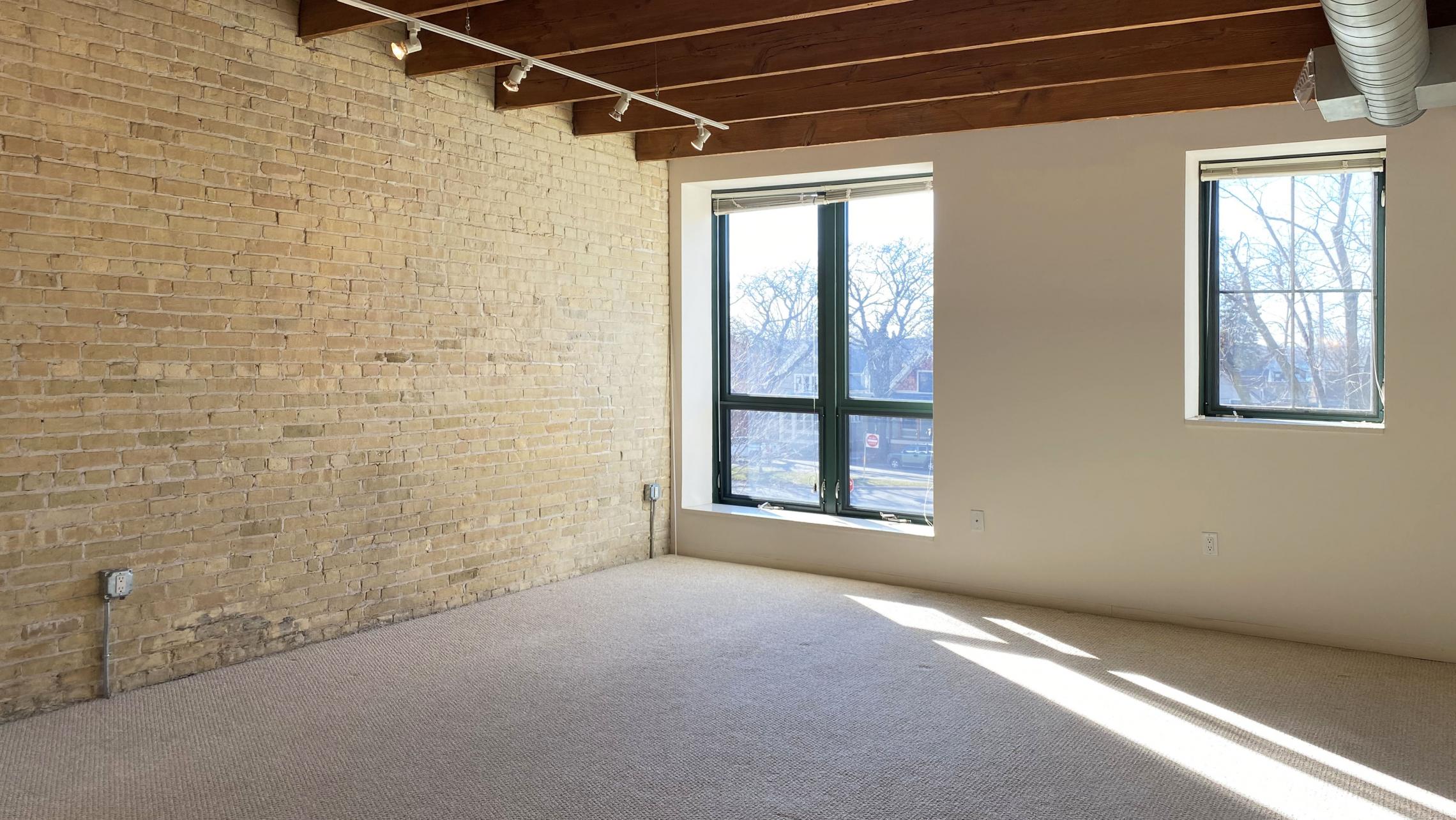 Tobacco-Lofts-at-The-Yards-Apartment-W206-Studio-Bathrom-Kitchen-Balcony-Historic-Exposed-Brick-Timber-Beams-Unique-Design-Cats-High-Ceiling-Balcony-Downtown-Madison-Fitness-Lounge-Courtyard-Top-Floor-Vaulted-Ceiling