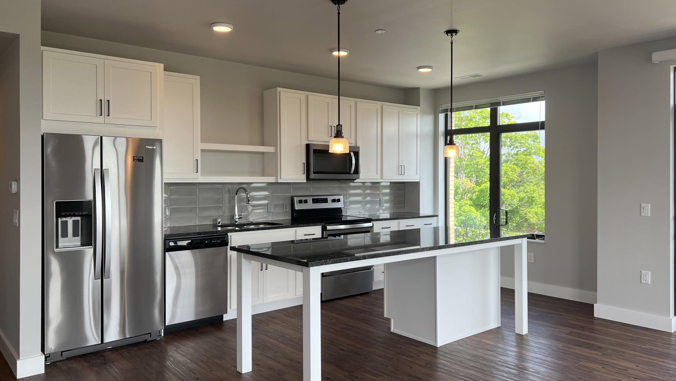 1722-Monroe-Apartment-401-two-Bedroom-One-Bathroom-Corner-Camp-Randall-Luxury-Living-Kitchen-Design-Rooftop-Terrace-Views-City-Madison-Fitness-Lounge-Balcony-Lifestyle-Capitol