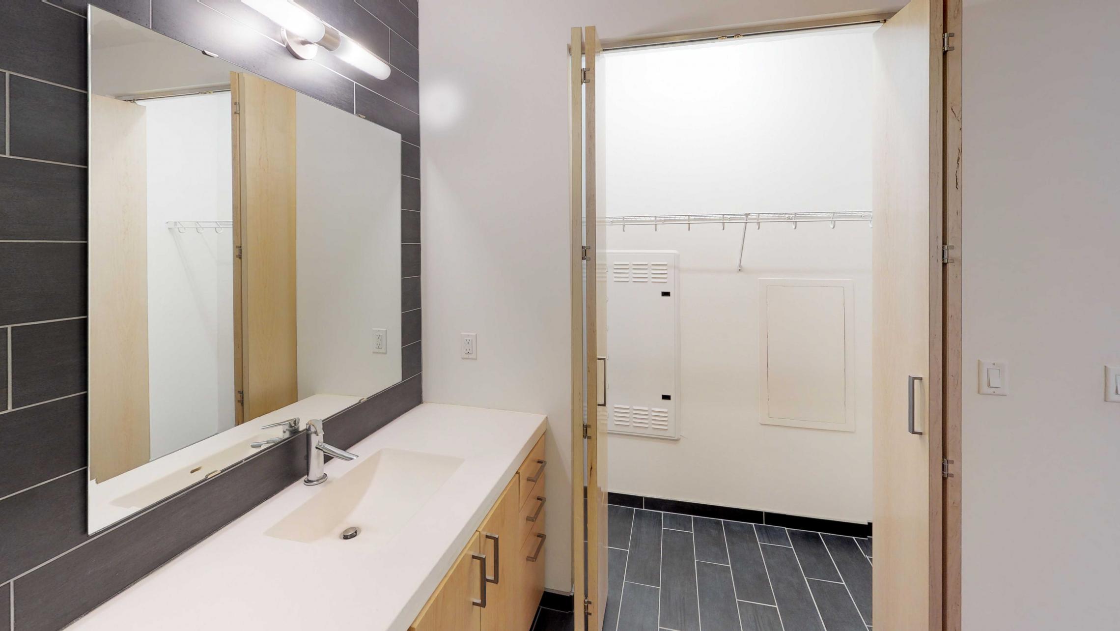 SEVEN27-Apartment-115-studio-lake view-modern-upscale-downtown-madison-patio-courtyard-bathroom-closet-storage.jpg