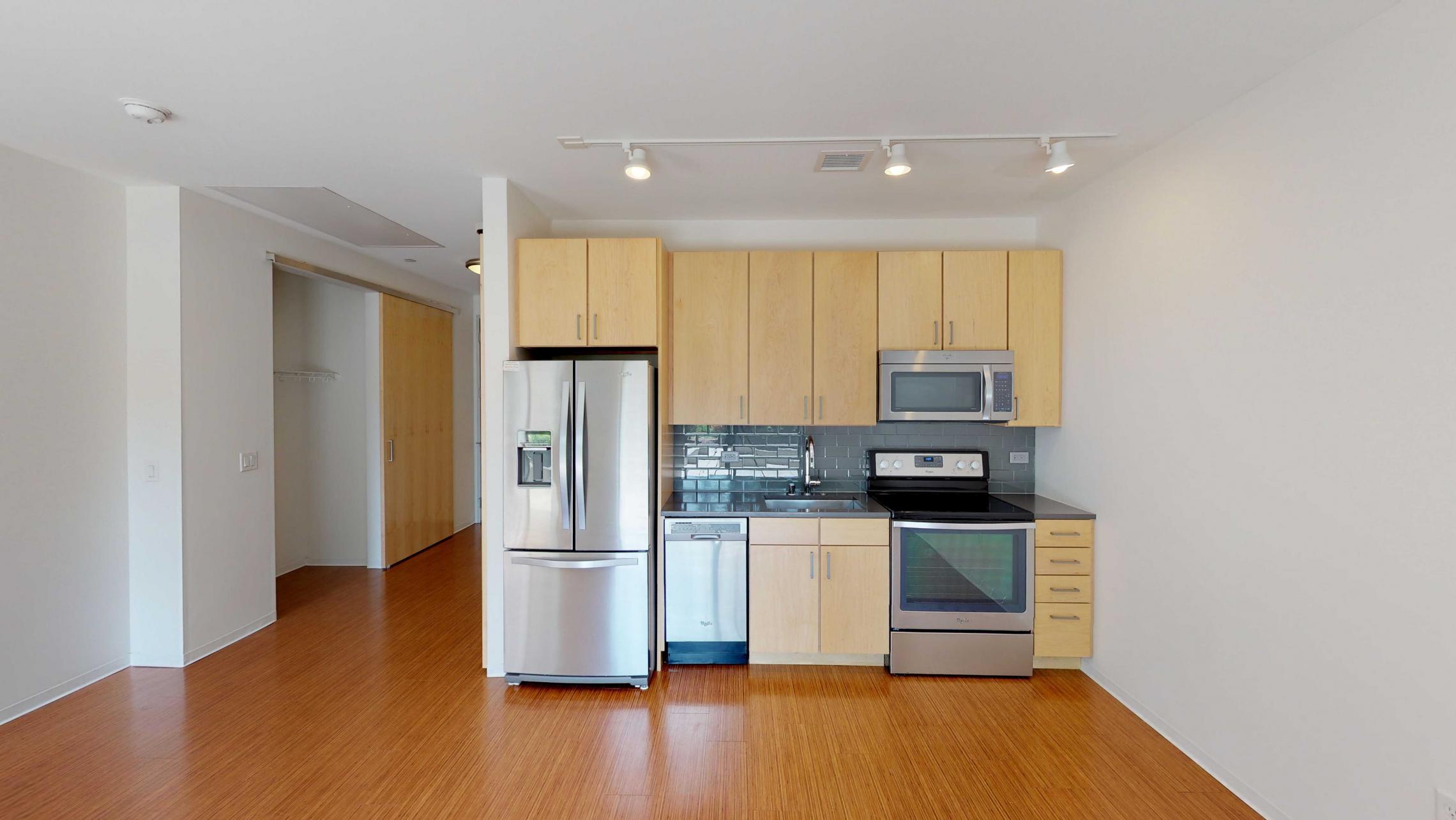 SEVEN27-Apartment-115-studio-lake view-modern-upscale-downtown-madison-patio-courtyard-living room-kitchen.jpg