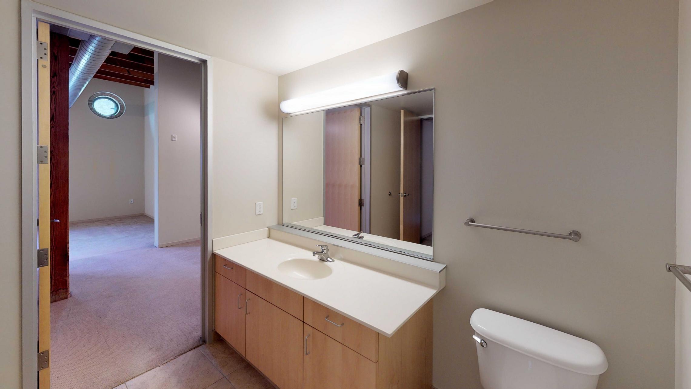 Tobacco-Lofts-Apartment-W219-Studio-Downtown-Madison-Historic-Brick-Exposures-Living-Room-Yards-Bedroom-Bathroom.jpg