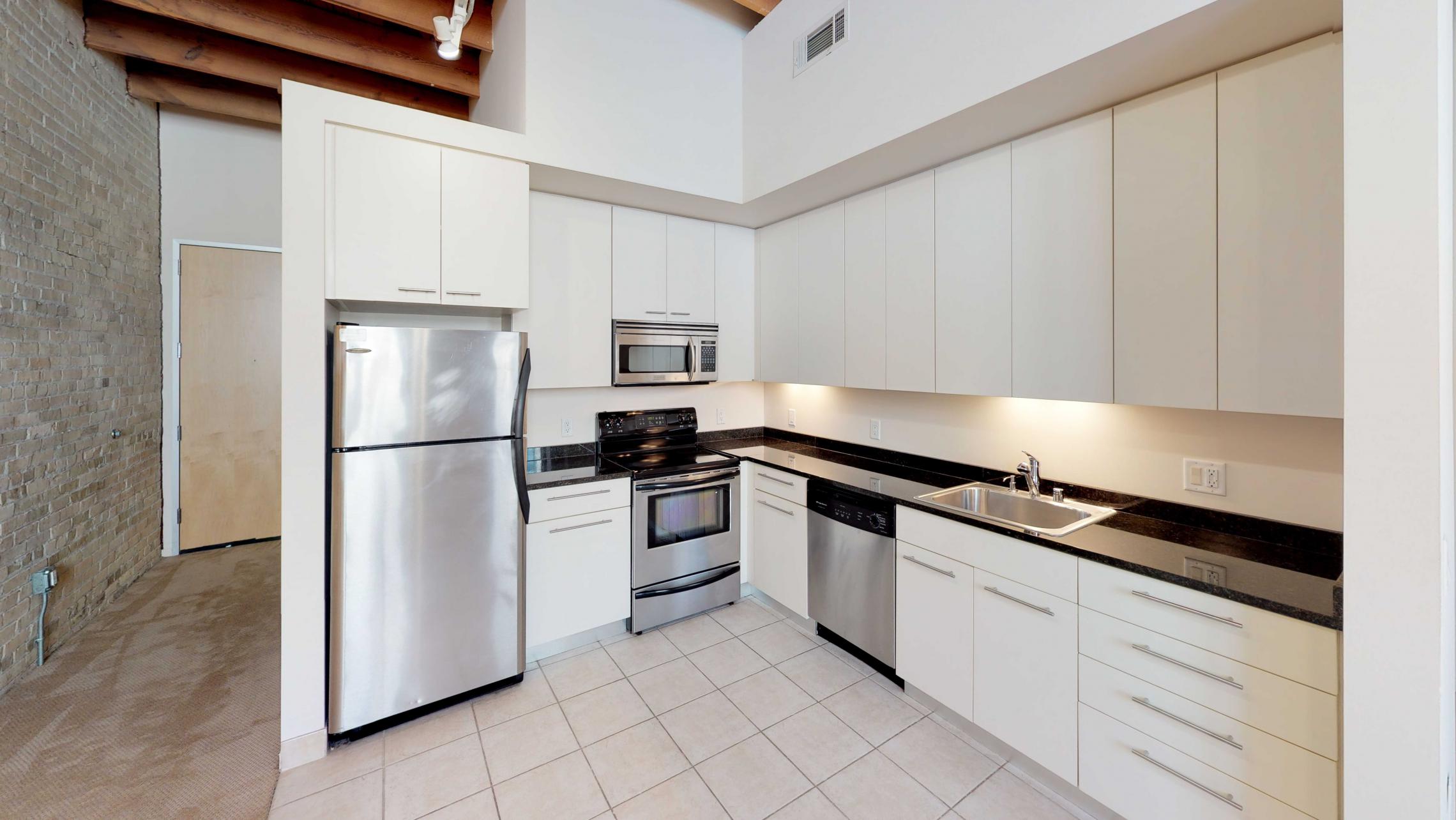 Tobacco-Lofts-W213-Kitchen-Studio-Apartment-Downtown-Madison-Historic-Exposures-Brick.jpg