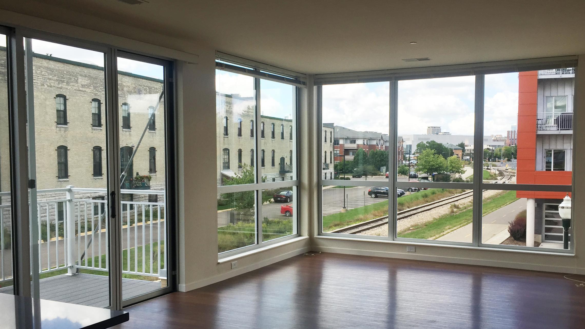 ULI Nine Line Apartment 314 - Living Room with view of Tobacco Lofts