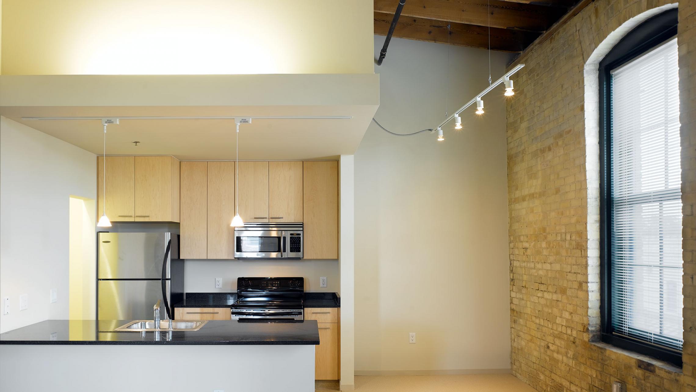 ULI Tobacco Lofts Apartments - Exposed Brick Beams