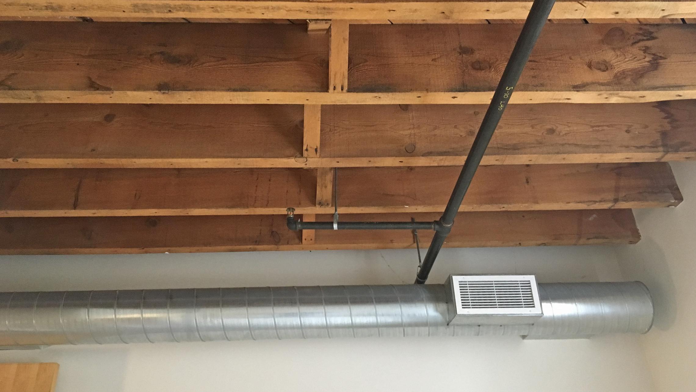 ULI Tobacco Lofts - E111 - Ceiling with Exposed Wood Beams