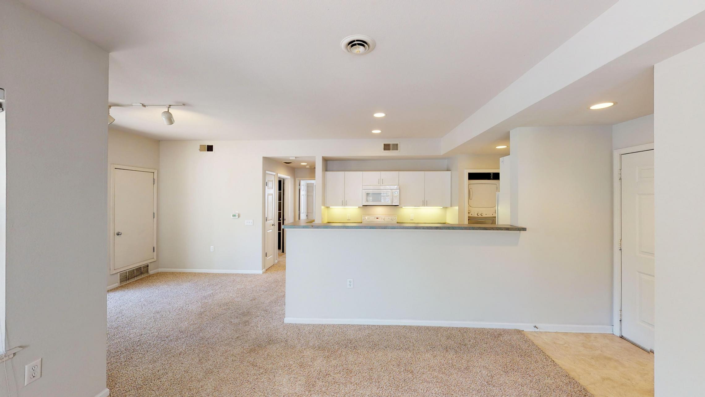 Wilson-Bay-Apartment-112-Two-Bedroom-Downtown-Corner-Balcony-Living-Dining.jpg