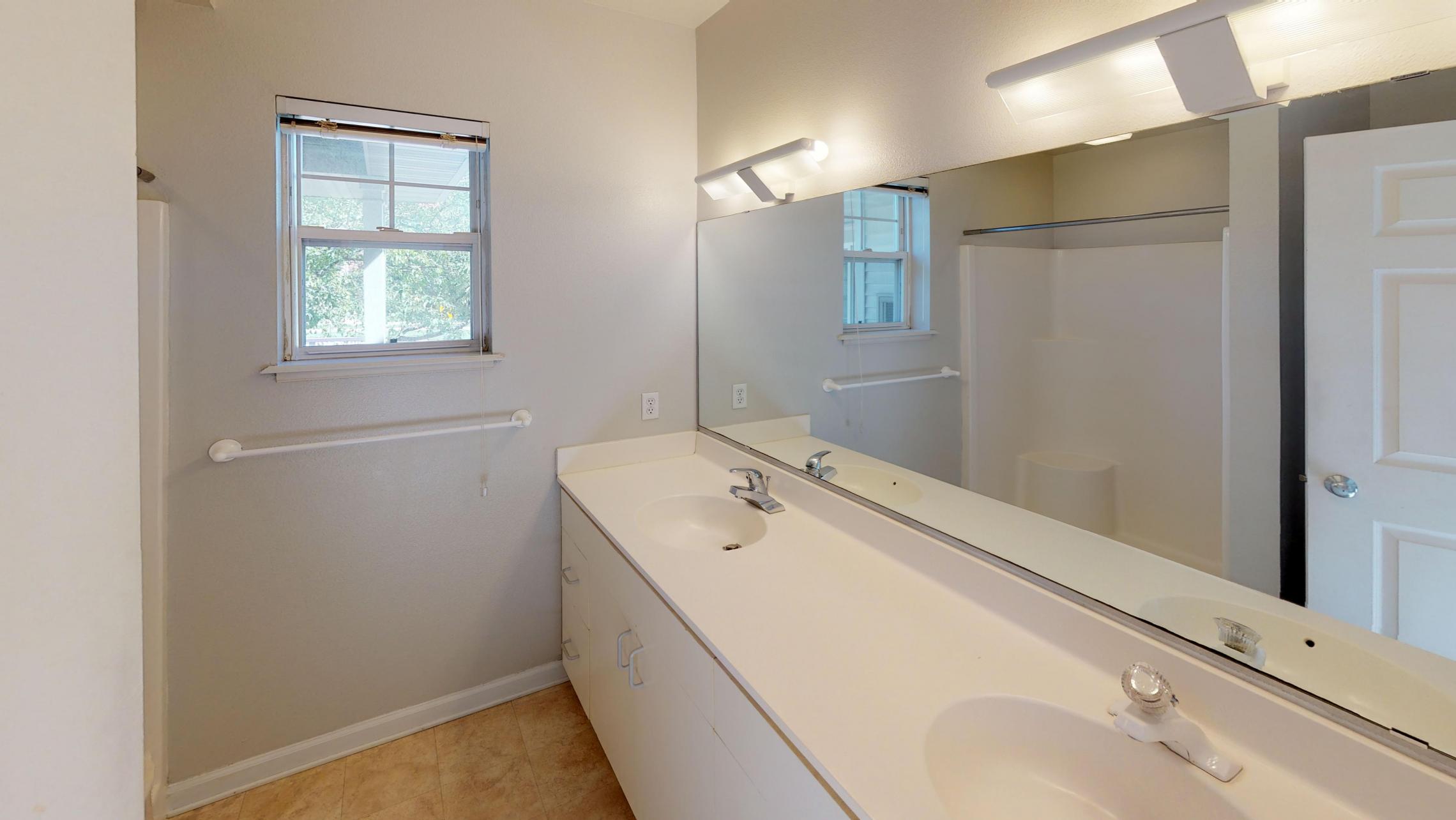 Wilson-Bay-Apartment-112-Two-Bedroom-Downtown-Madison-Master-Bathroom-Double-Sinks-Corner-Window.jpg